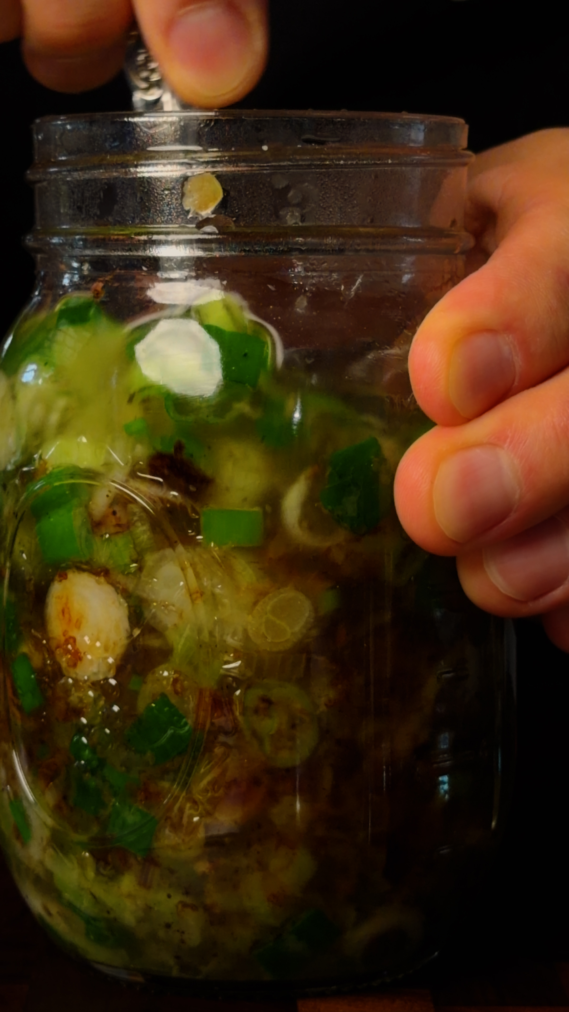 Finished scallion-ginger oil in a mason jar