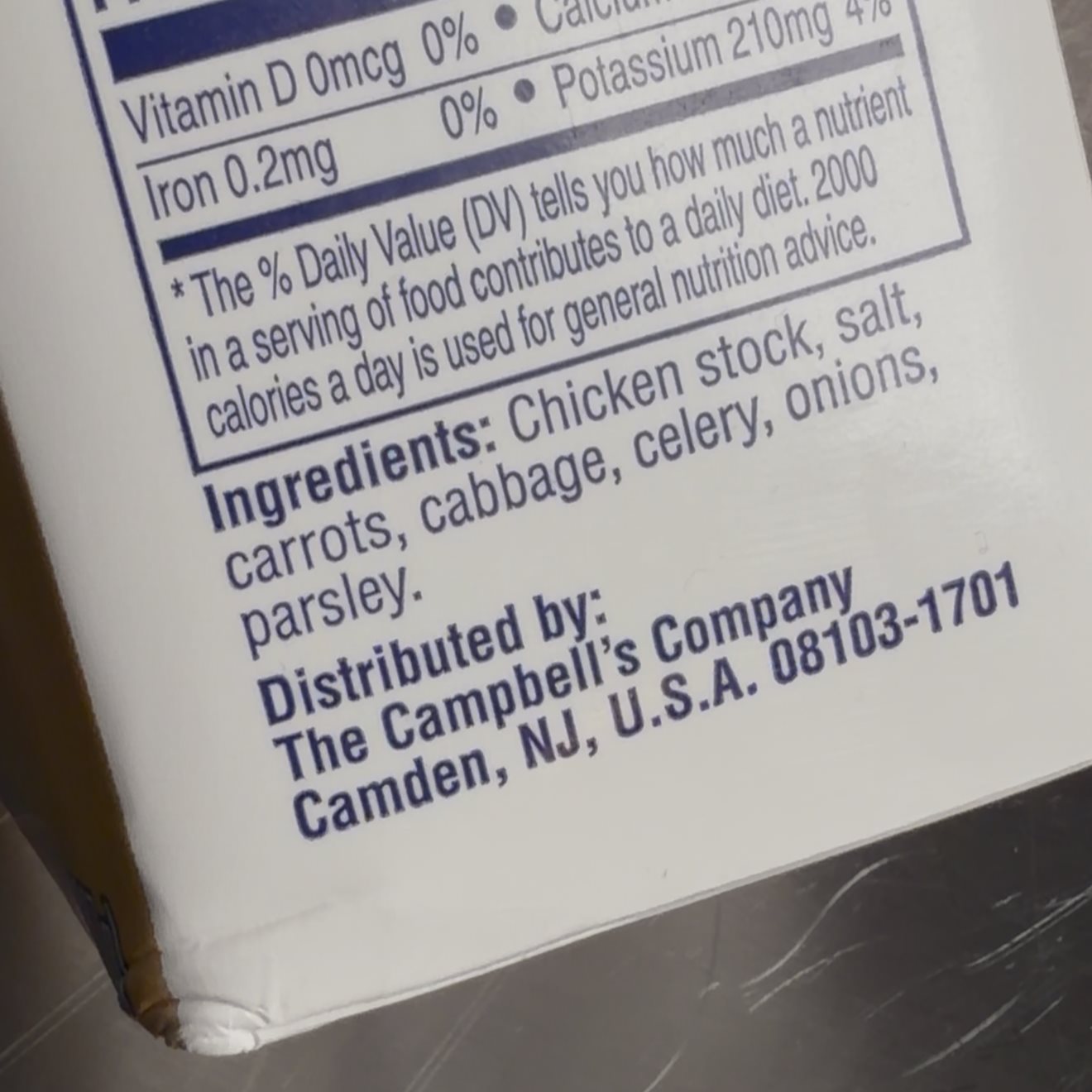 Chicken stock ingredients label showing chicken stock, vegetables, salt