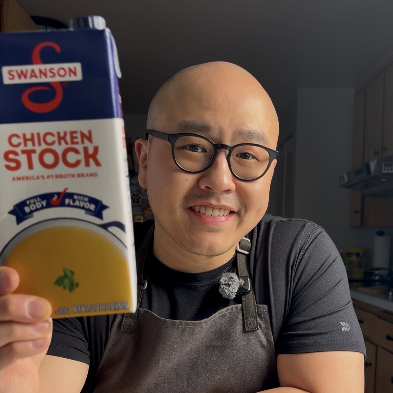 Charles holding a Swanson chicken stock carton