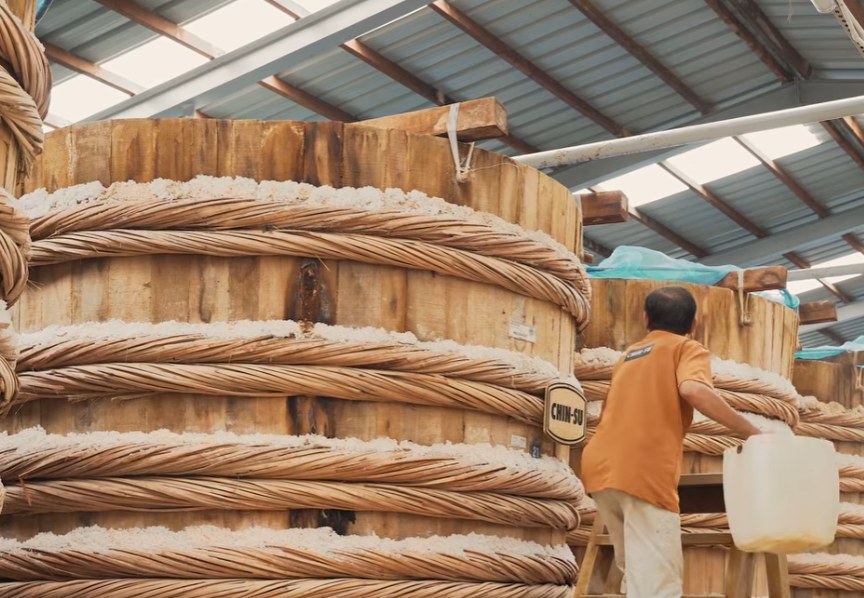 Large fermentation barrels at a fish sauce facility in Vietnam