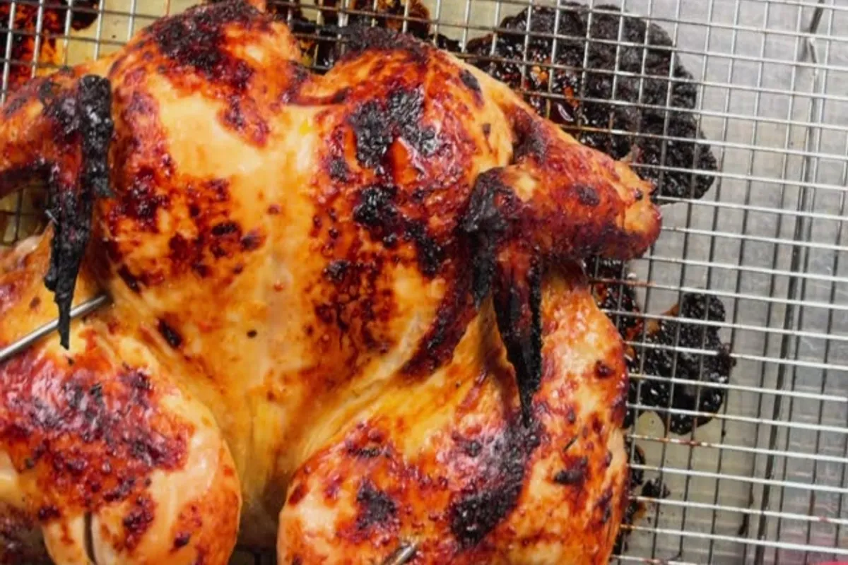 Chipotle roast chicken, spatchcocked, glossy and deep red, shot from above