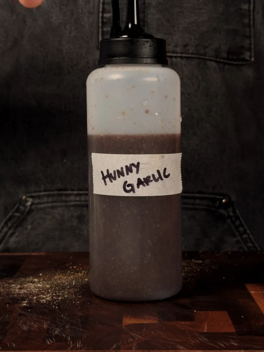 A squeeze bottle labeled Honey Garlic
