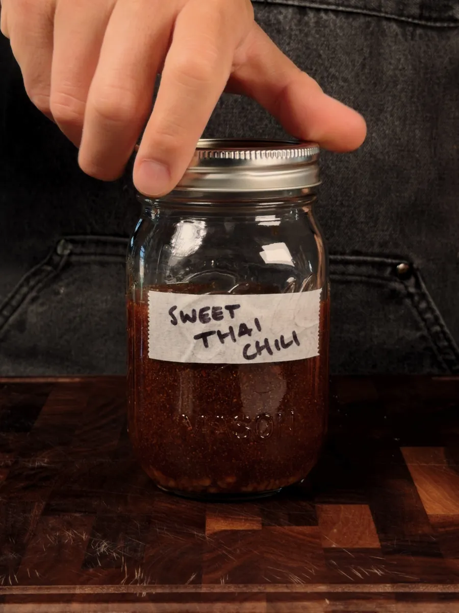 A mason jar labeled Sweet Thai Chili