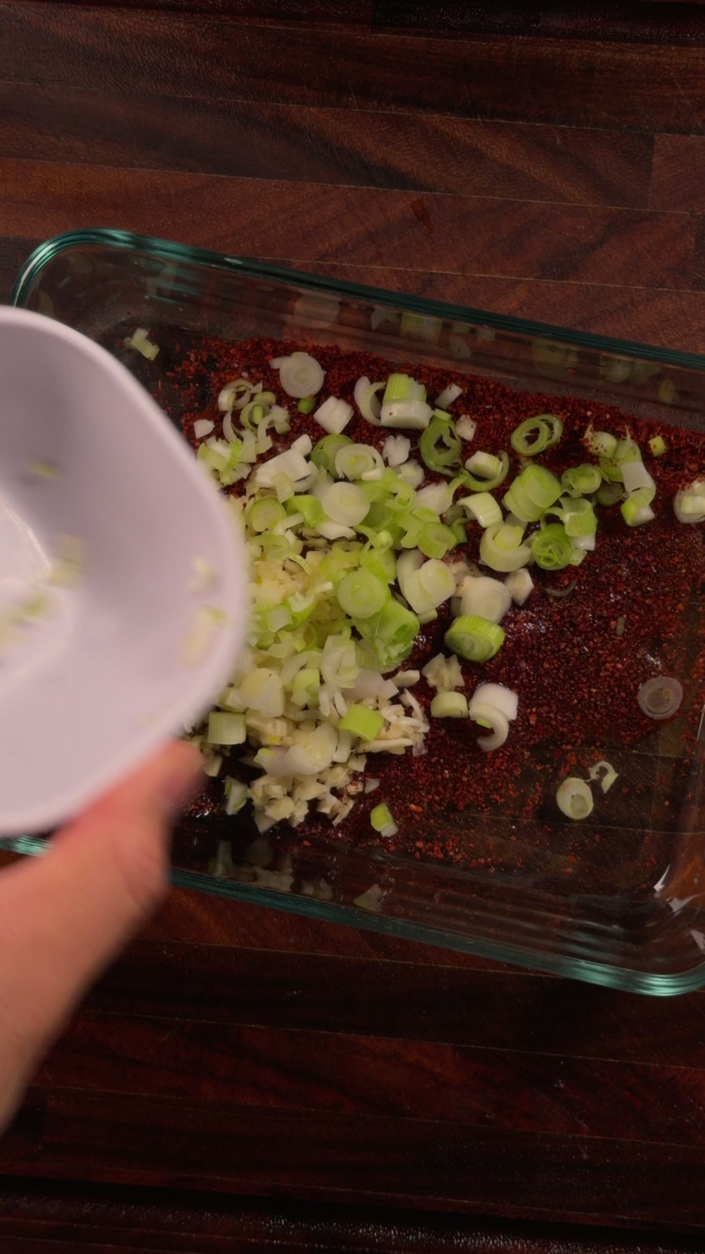 Adding garlic and green onion.