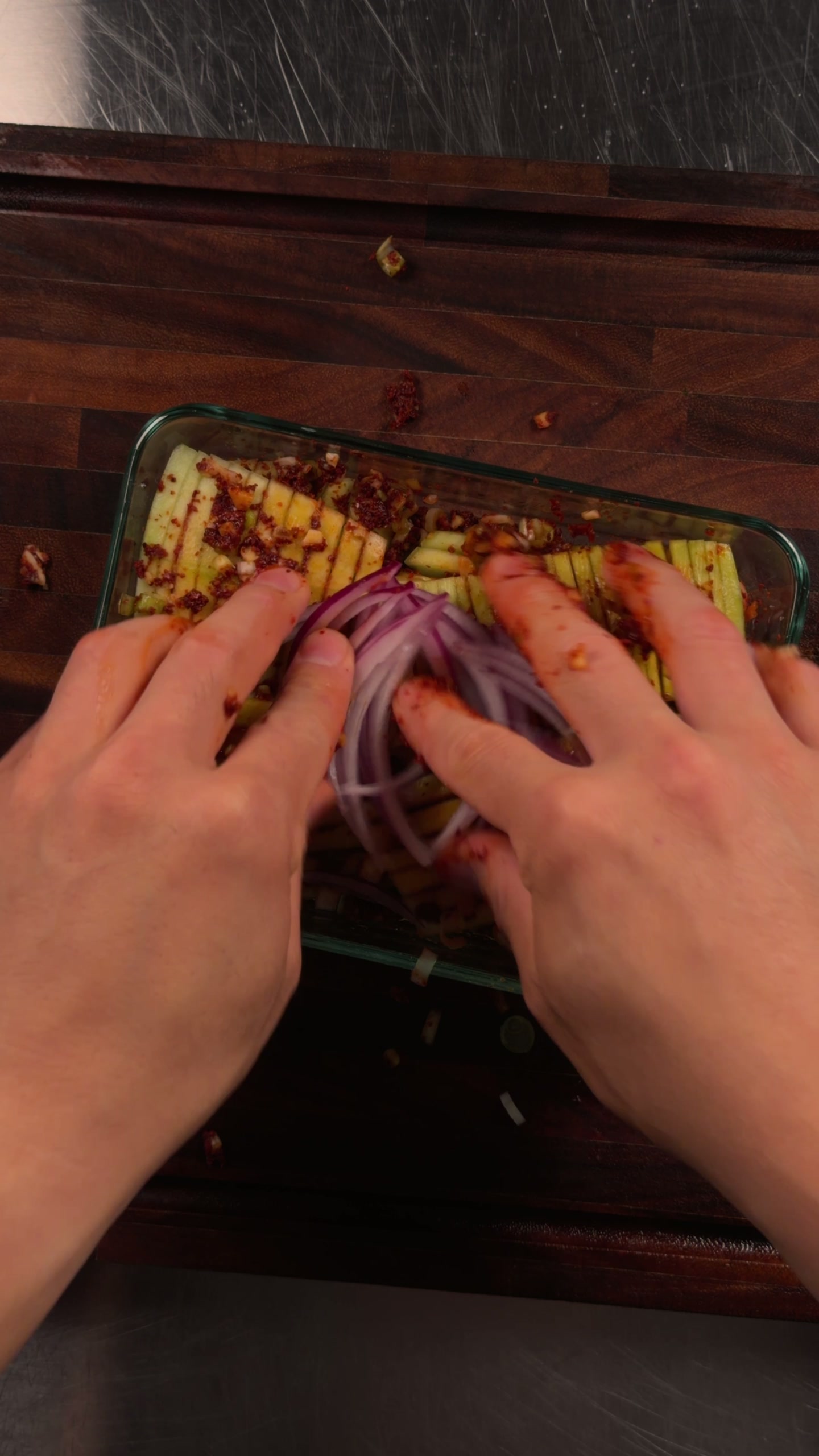 Tossing the rind in the spicy sauce.