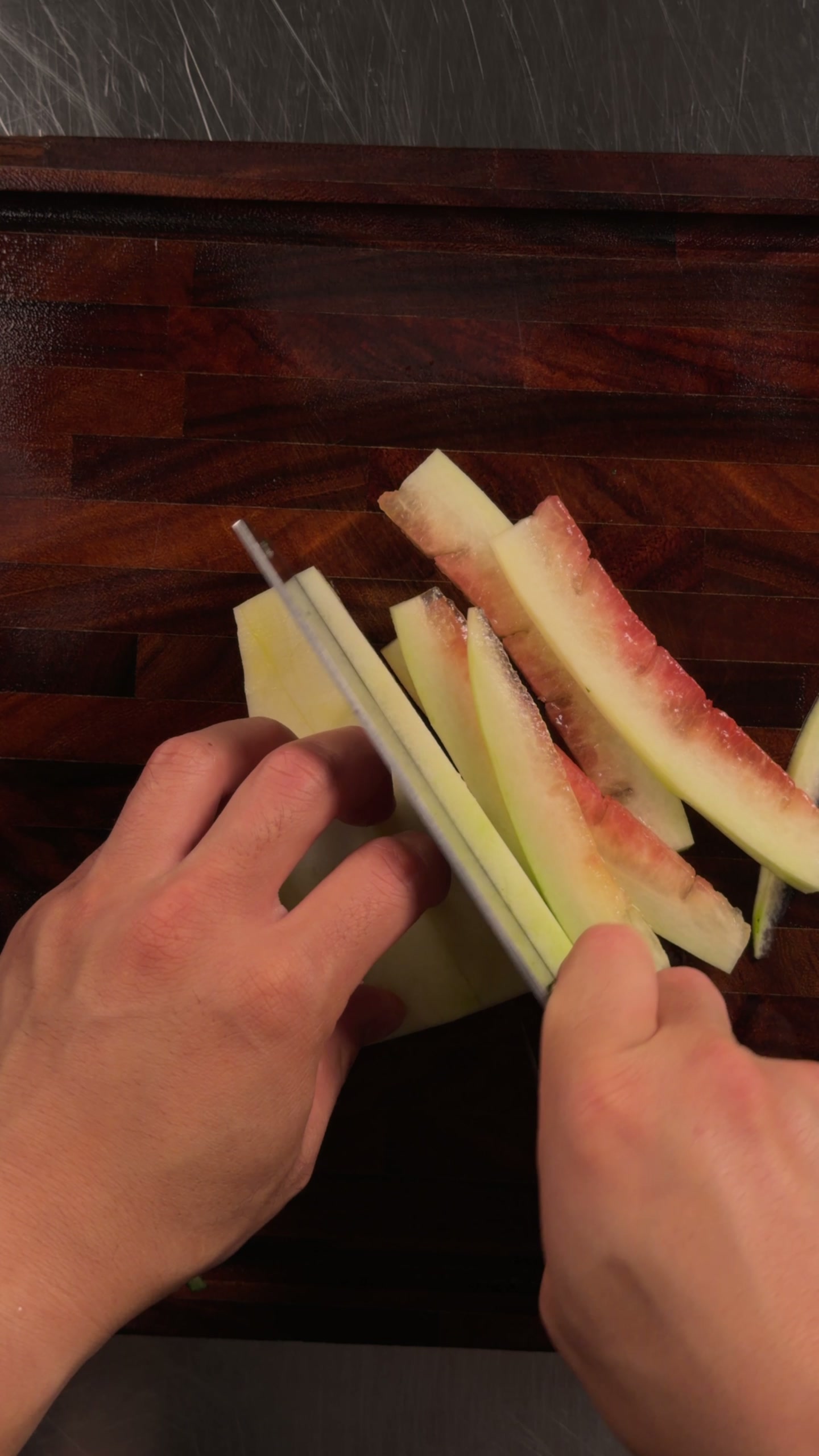 Cutting the rind into batons.