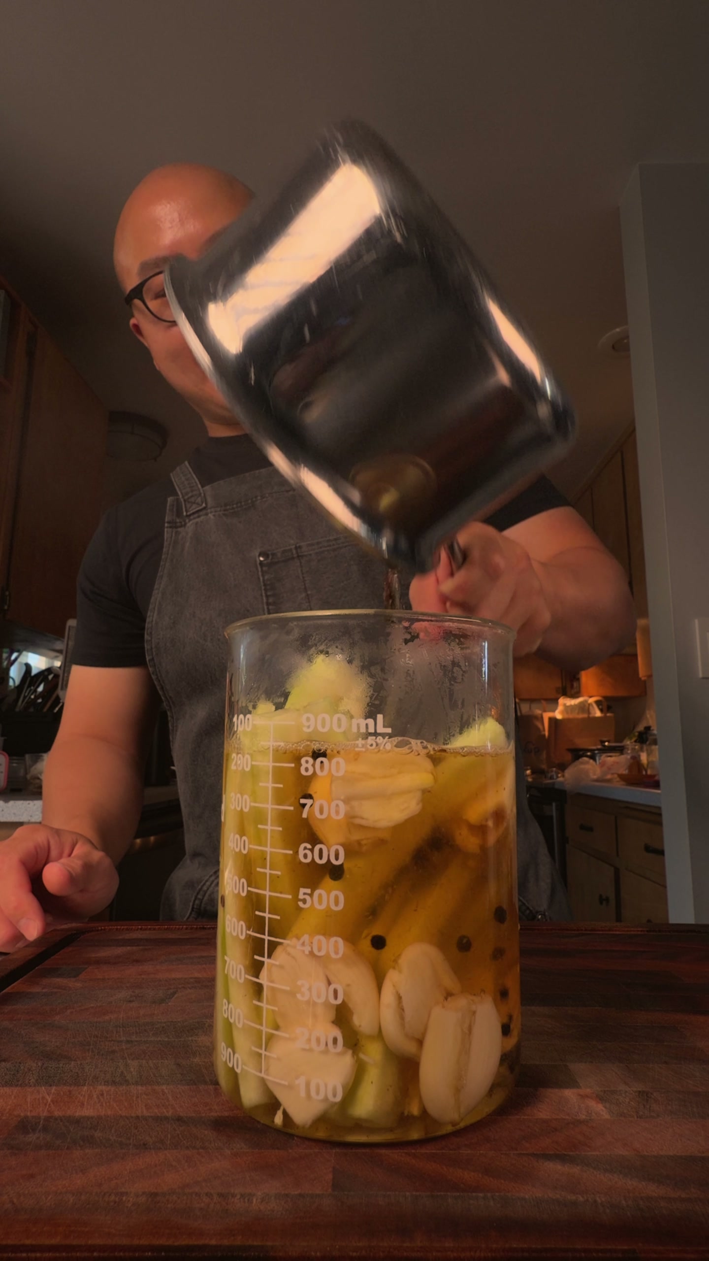Pouring the hot brine over the rind.